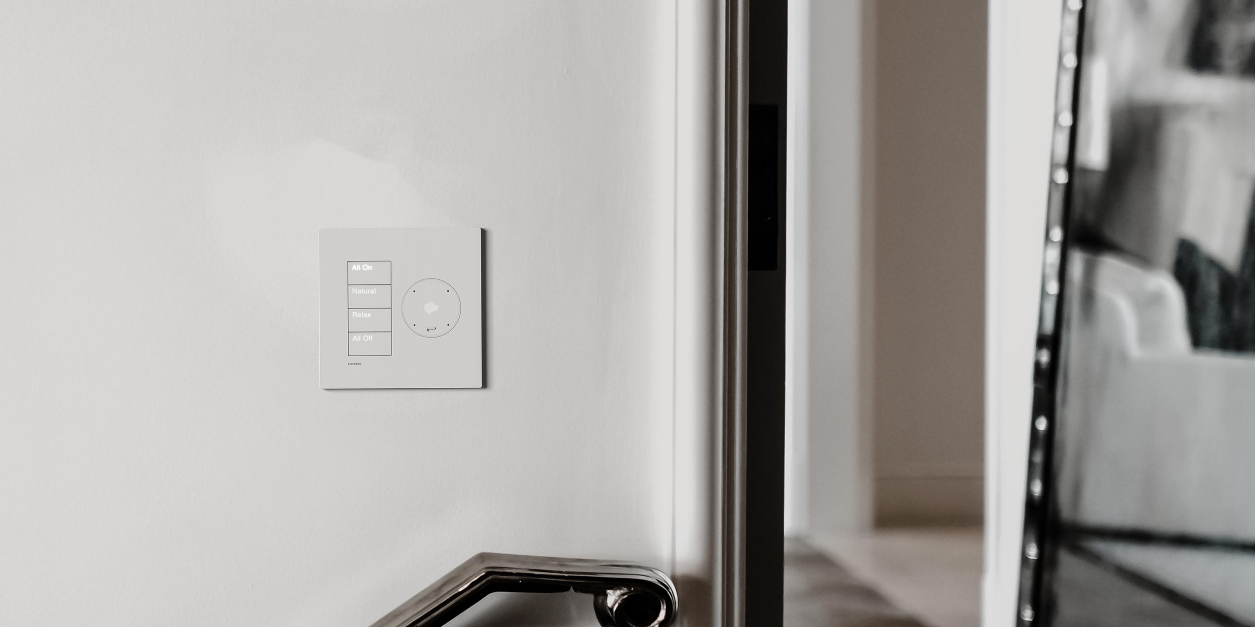 Modern living room with an open kitchen, contemporary decor, and integrated home automation.