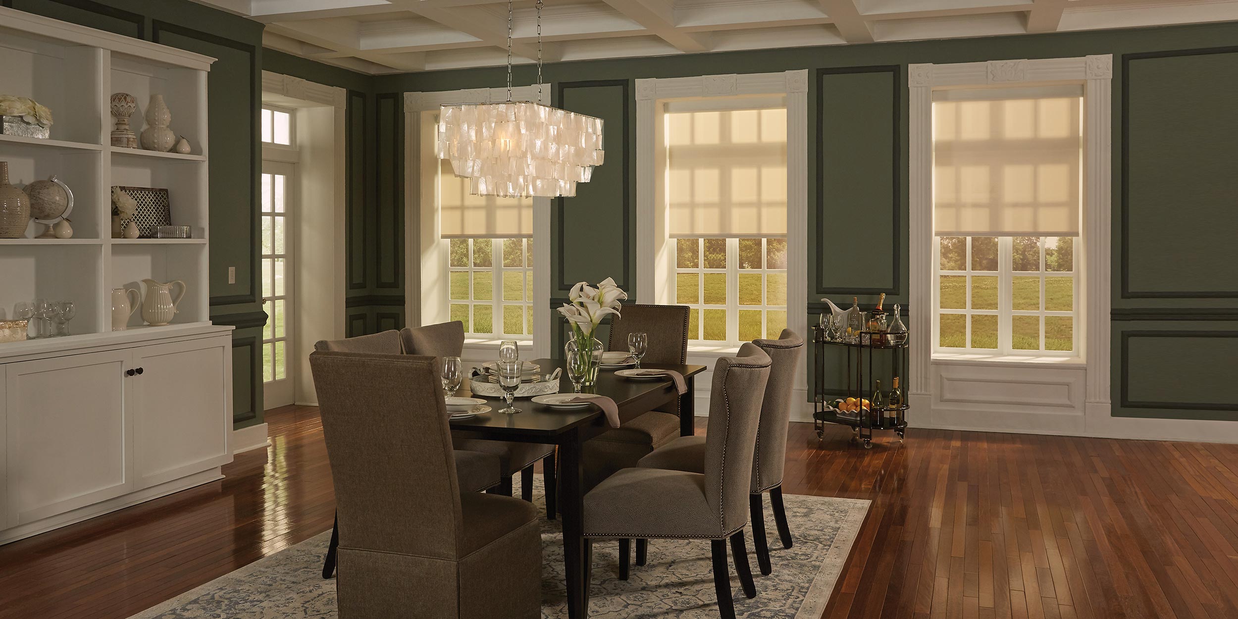 Elegant dining room with natural light filtering through motorized window shades.